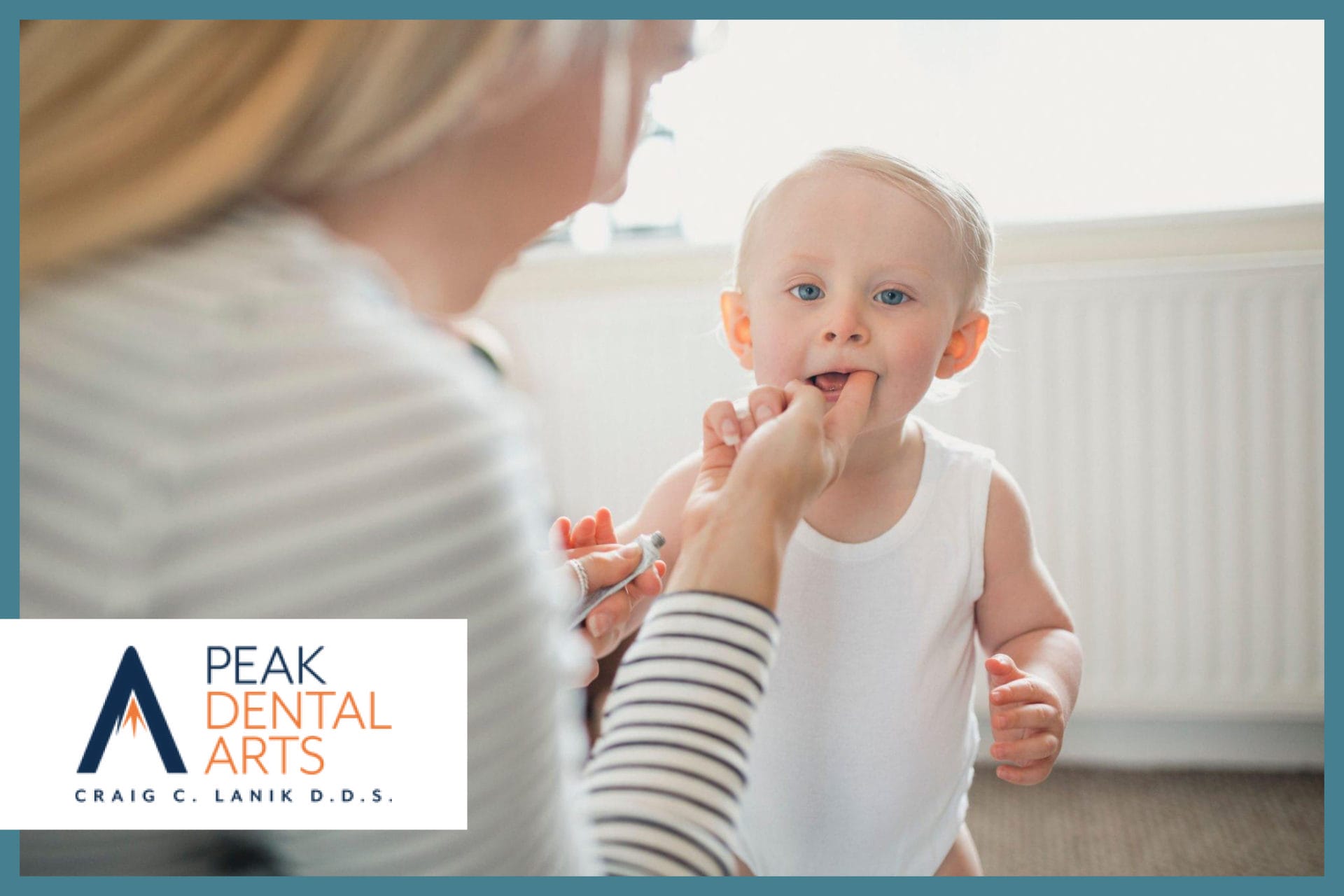Woman checking her baby's mouth
