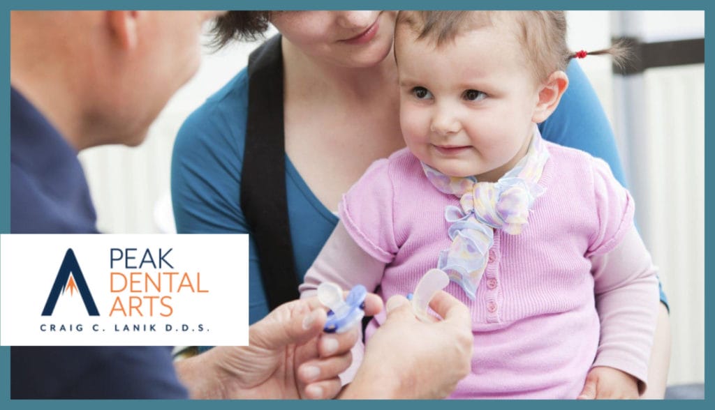 woman and baby having dental care to a dentist